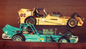Jim Shampine (8-ball) outside of Eddie Beliinger Jr. (02) on a pace lap prior the start of the 1980 Oswego Classic. Peter Montano photo.
