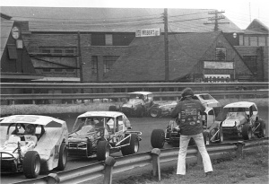 An incident brings out the caution as (99B) Geoff Bodine, (57) Tommy Corellis and (3) Jimmy Horton speed by. Rick Sweeten photo.